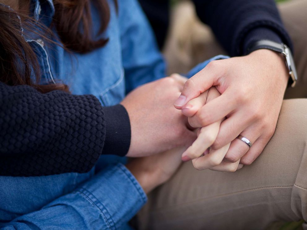 PHOTO: Stock photo of a couple holding hands.