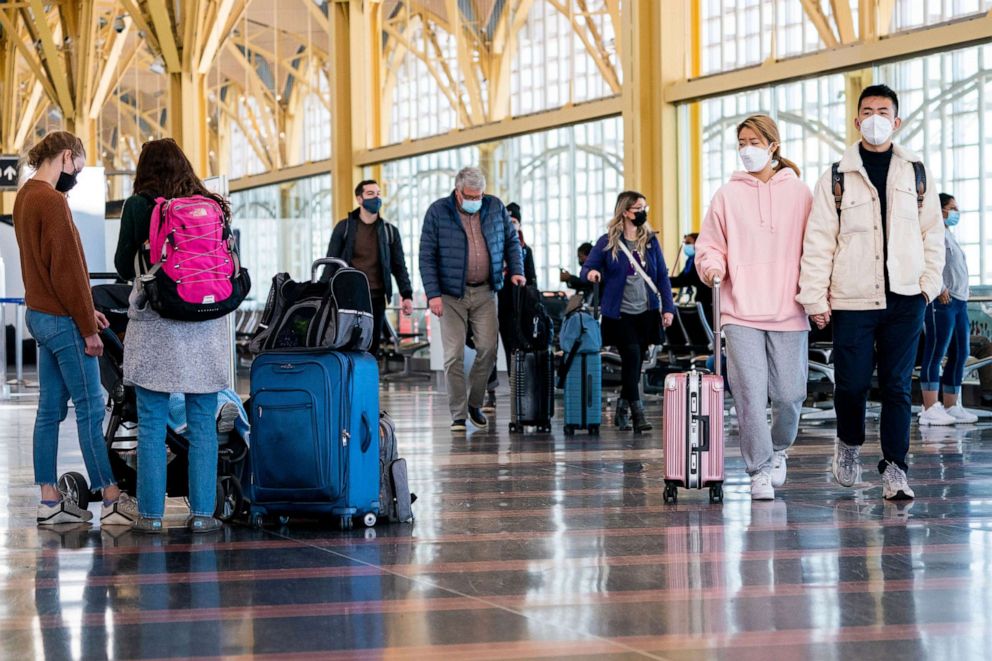 PHOTO: Travelers navigate the ticketing area at Reagan National Airport in Arlington, Va., Nov. 24, 2021.