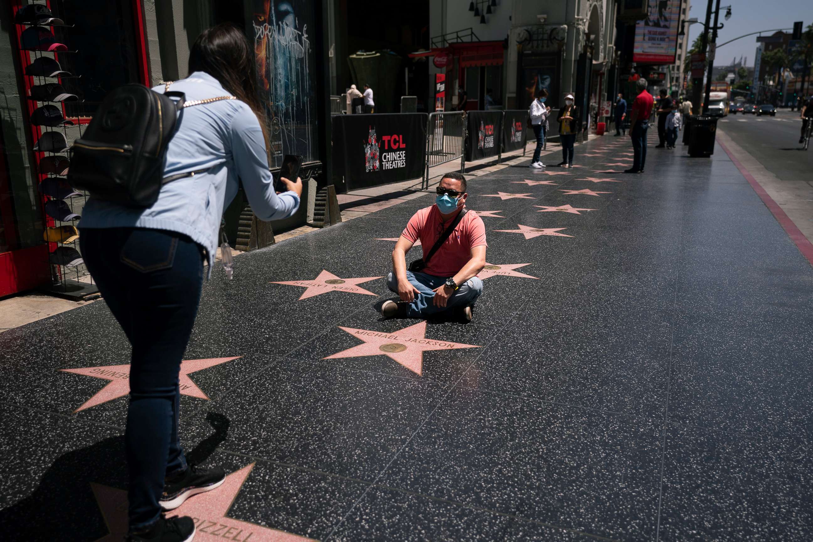 PHOTO: People take photos while visiting the Hollywood Walk of Fame in the Hollywood section of Los Angeles, May 3, 2021.