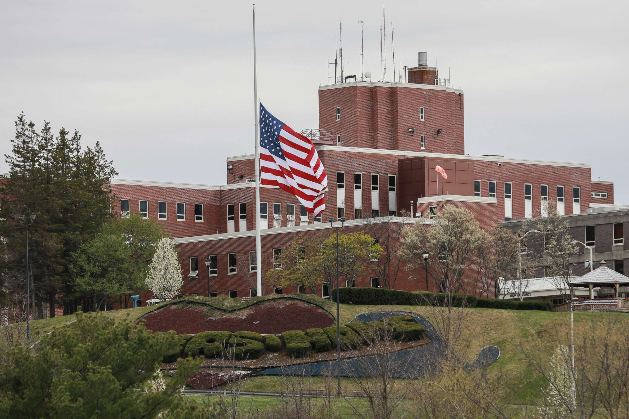 PHOTO: An American flag flies at half-mast outside the Holyoke Soldiers' Home on April 29, 2020 in Holyoke, Mass.