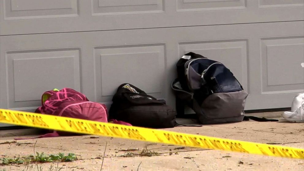 PHOTO: Bags sit outside home in Huber Heights, Ohio where two kids were found tied up after a reported home invasion, May 22, 2018. A few hours later, one victim's dad was found dead in a Springfield park.