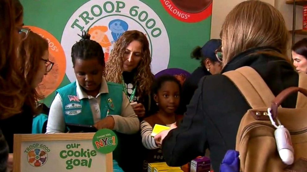 PHOTO: Members of Girl Scout Troop 6000, New York's first homeless shelter-based troop, hold their first cookie sale in Union Square, Manhattan in April 2018. 