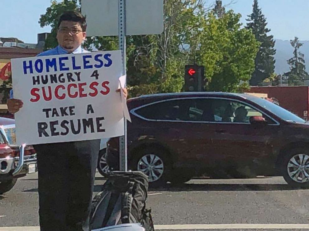   PHOTO: David Casarez handed CVs at the corner of a street in Mountain View, California, looking for a job. 