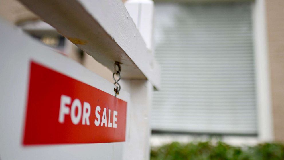 PHOTO: A "For Sale" sign is displayed in front of a renovated house in Washington on April 24, 2020. 