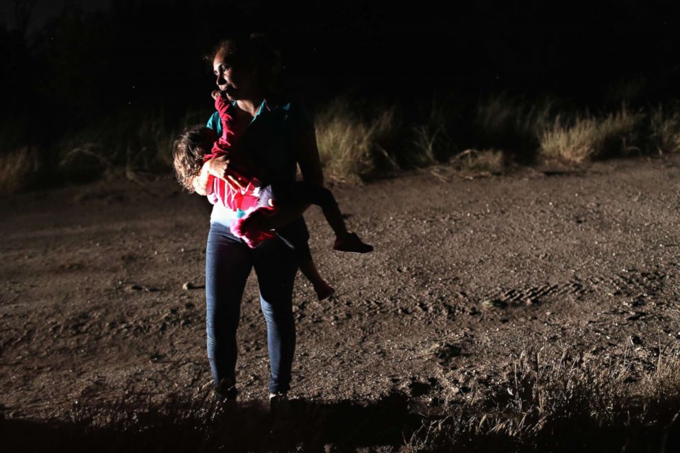 PHOTO: A Honduran mother holds her two-year-old daughter while being detained by U.S. Border Patrol agents near the U.S.-Mexico border on June 12, 2018, in McAllen, Texas. 