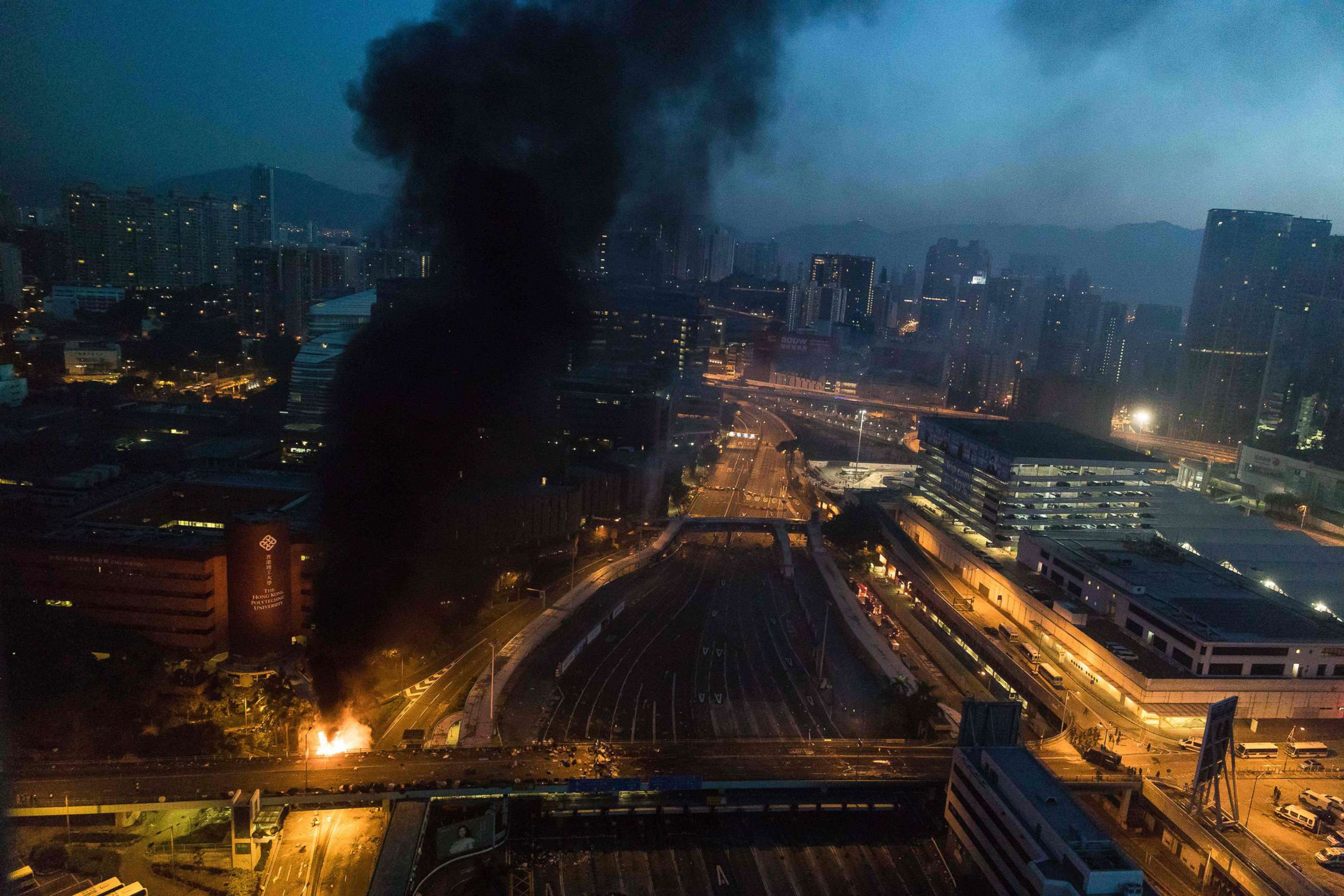 PHOTO: Smoke billows from a fire next to Hong Kong Polytechnic University and the road leading to the Cross Harbour Tunnel in Hung Hom district of Hong Kong on Nov. 18, 2019.