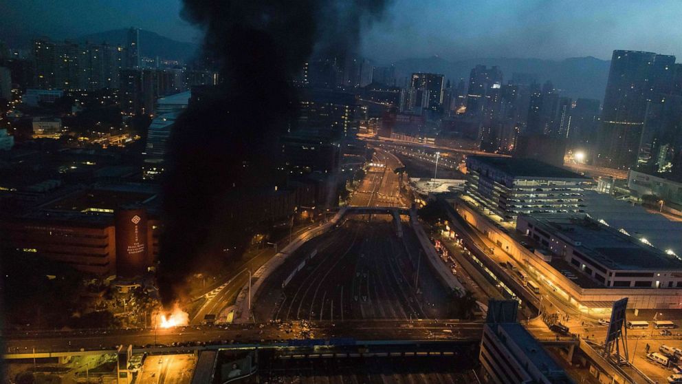 PHOTO: Smoke billows from a fire next to Hong Kong Polytechnic University and the road leading to the Cross Harbour Tunnel in Hung Hom district of Hong Kong on Nov. 18, 2019.