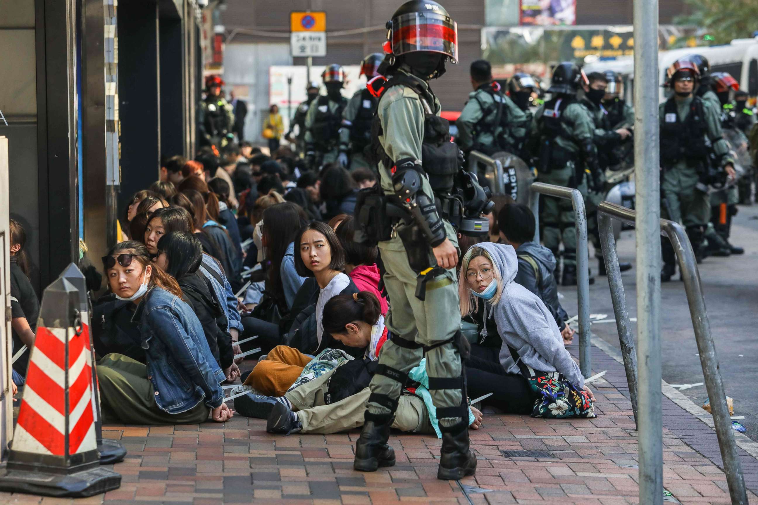PHOTO: People are detained by police near the Hong Kong Polytechnic University in Hung Hom district of Hong Kong on Nov. 18, 2019.