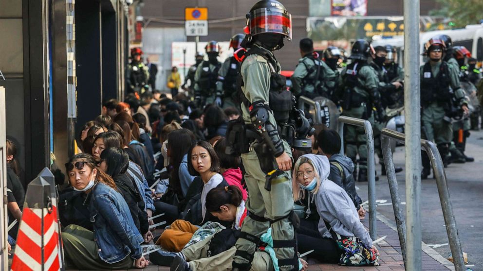 PHOTO: People are detained by police near the Hong Kong Polytechnic University in Hung Hom district of Hong Kong on Nov. 18, 2019.