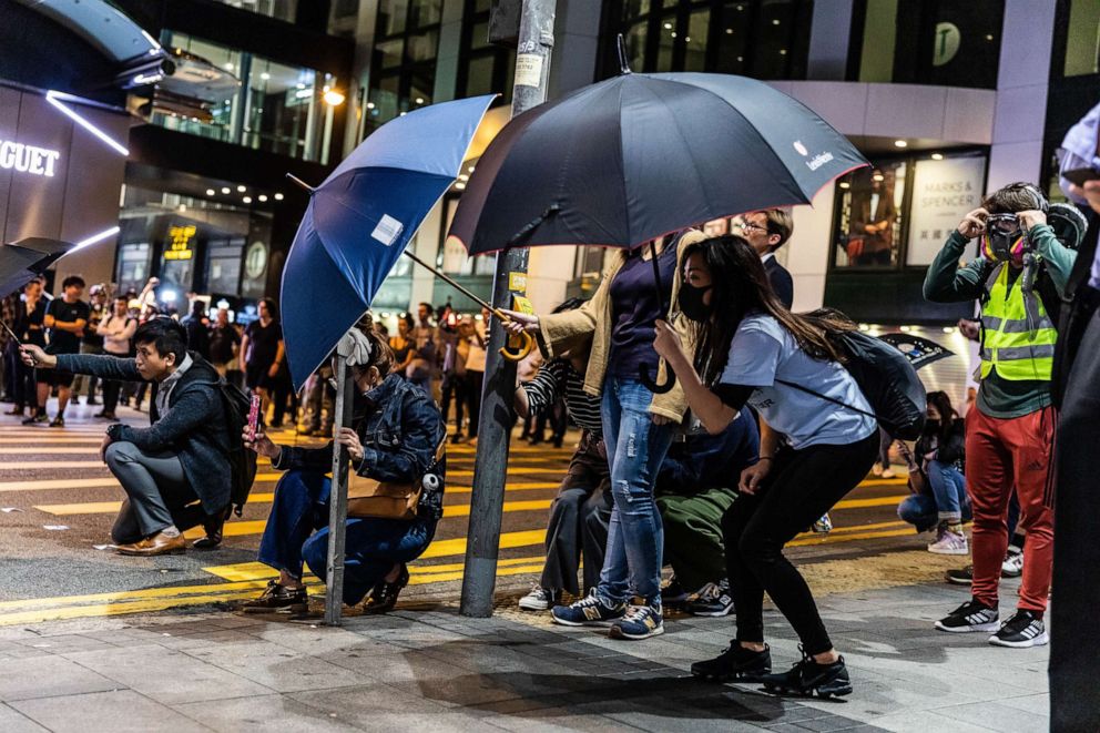 PHOTO: Protesters open umbrellas in fear of the police shooting during anti-government protests in Hong Kong, China, Nov. 12, 2019.