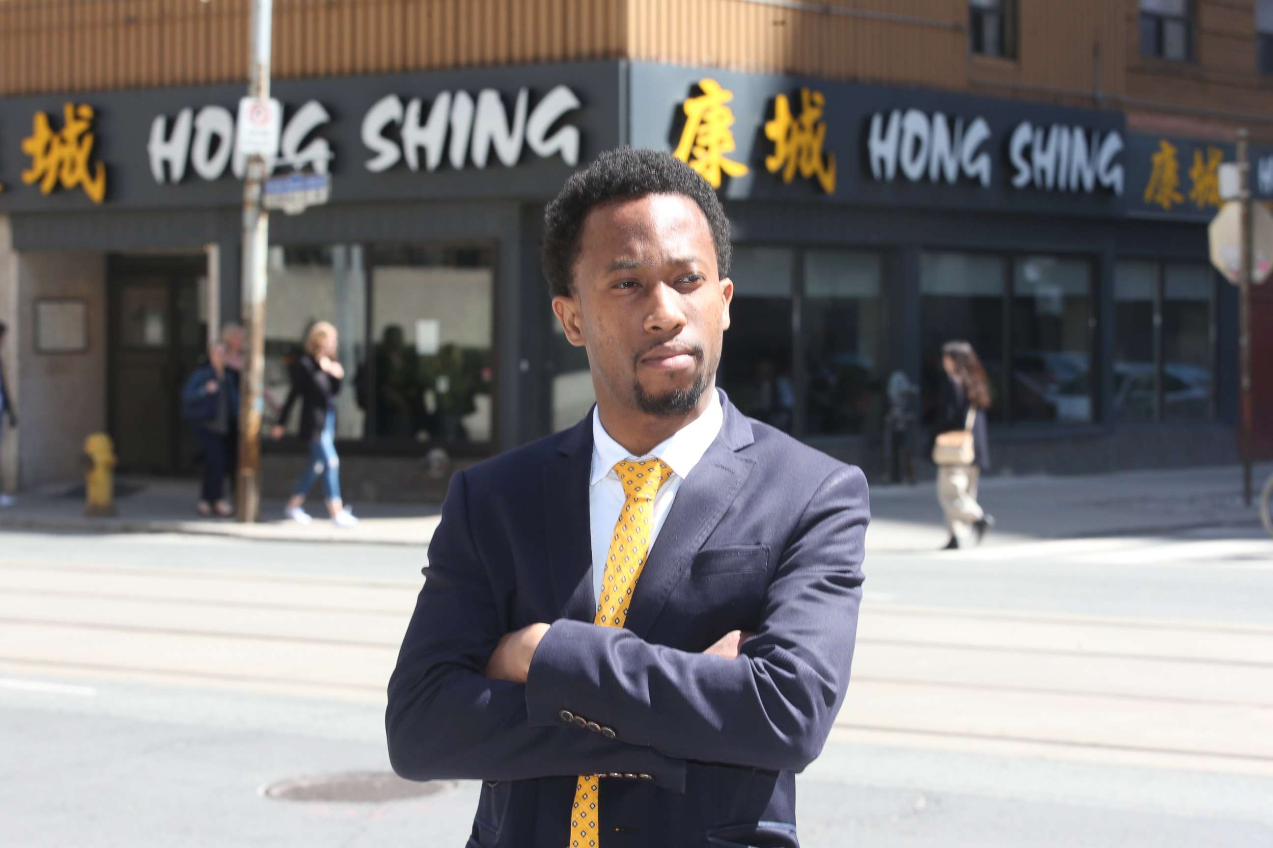 PHOTO: Emile Wickham stands in front of the Hong Shing Chinese restaurant in Toronto on April 30, 2018.