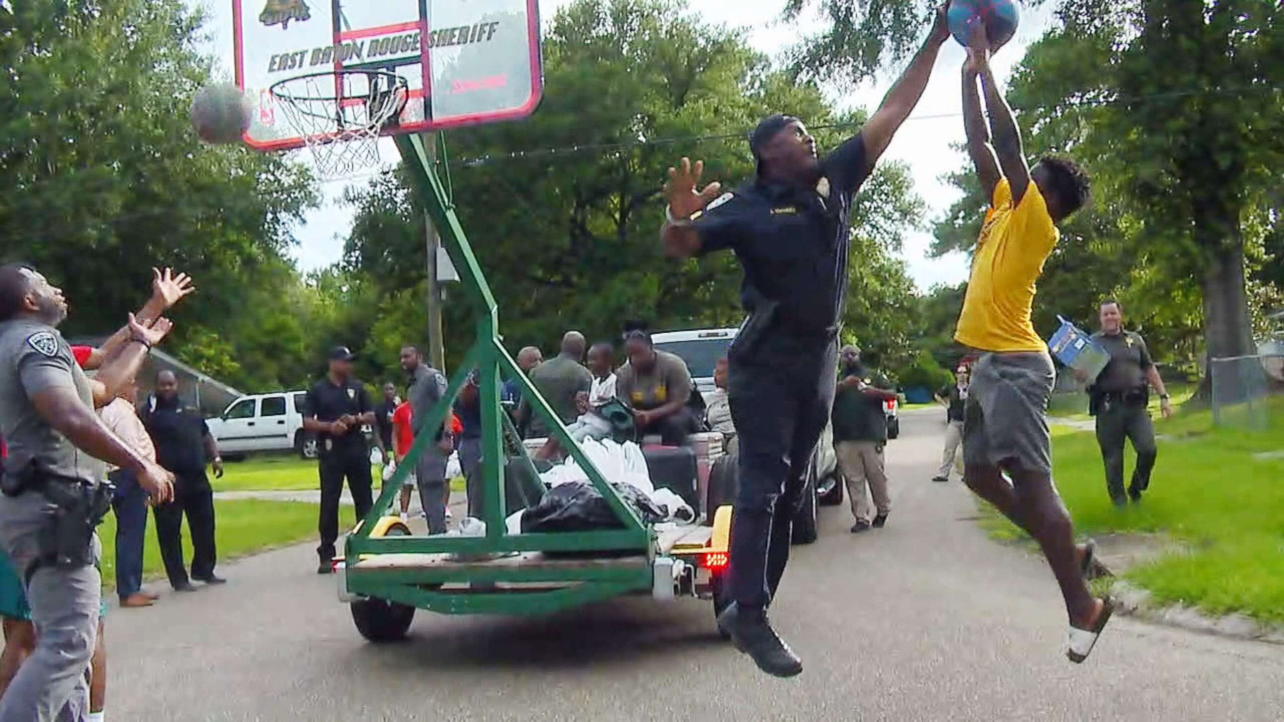 PHOTO: Police and Sheriff’s office personnel bring basketball and music to the community in order to build relationships of trust in East Baton Rouge Parish, La., June 28, 2021.