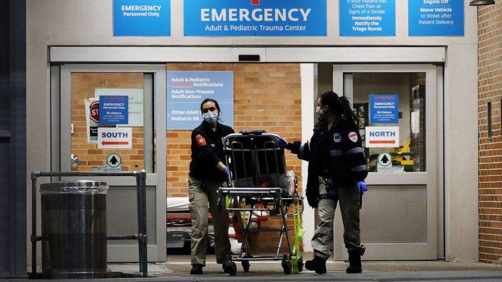 PHOTO: Medical workers walk outside a special coronavirus area at Maimonides Medical Center on May 26, 2020 in New York City.
