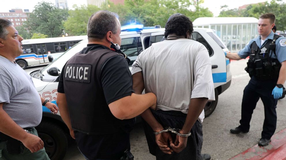 PHOTO: A man is detained by police outside of Jesse Brown VA Medical Center after reports of possible shots fired inside the hospital, Aug. 12, 2019 in Chicago.