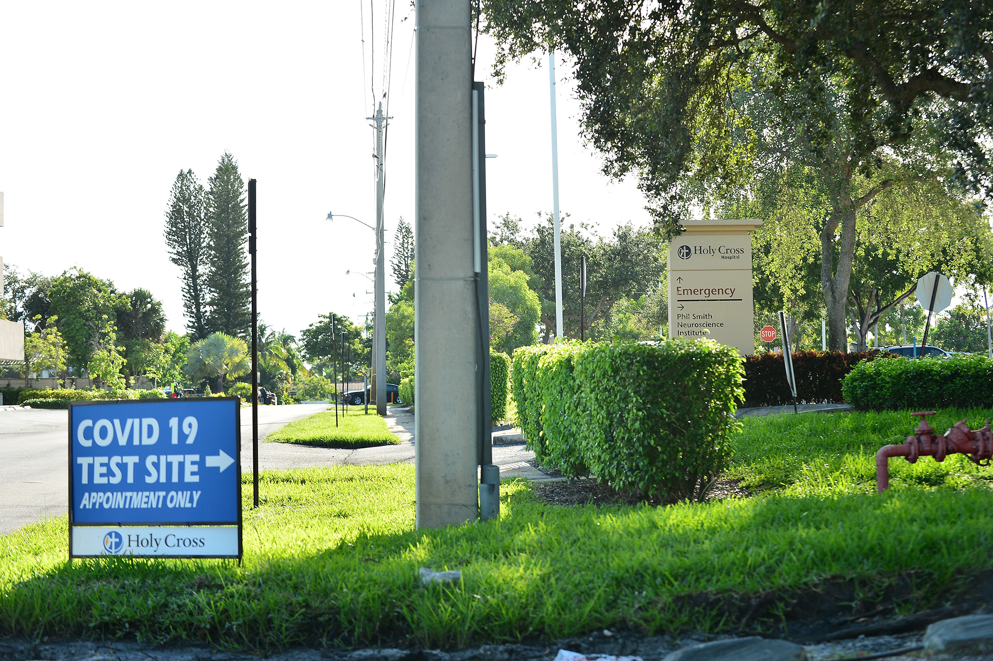 PHOTO: Signage indicating that COVID-19 tests are available by appointment only marks an entrance at Holy Cross Hospital in Fort Lauderdale, Fla.,  July 29, 2020.