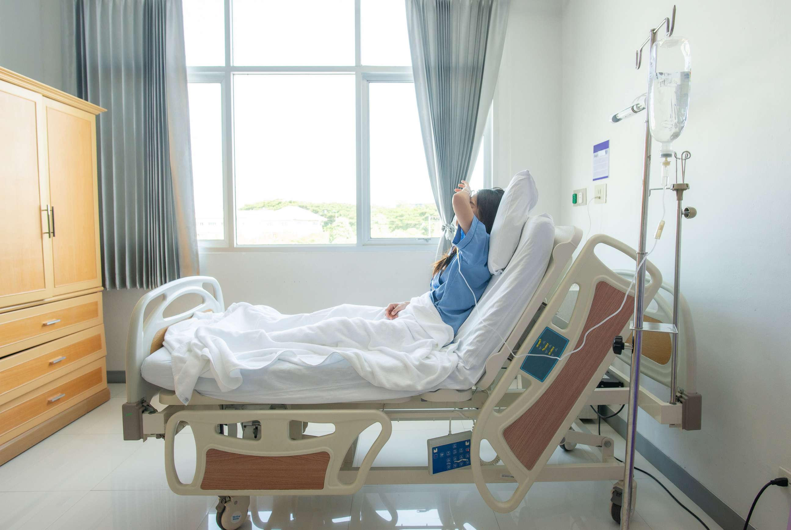 PHOTO: a patient in a hospital bed.