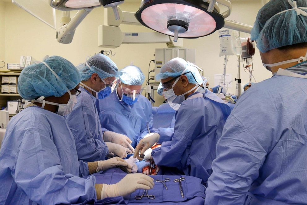 PHOTO: Doctors perform surgery on a gunshot victim at Cook County's Stroger Hospital in Chicago, Aug. 6, 2014.