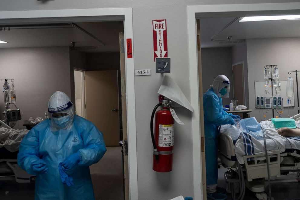 PHOTO: Medical staff members treat patients in the COVID-19 intensive care unit at the United Memorial Medical Center on Nov. 14, 2020, in Houston.