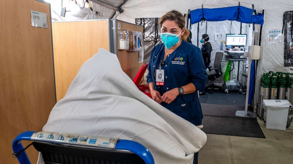 PHOTO: In this Dec. 29, 2021, file photo, a nurse speaks with a new patient just arriving inside the respiratory tent outside the Emergency Department at Martin Luther King Jr. Community Hospital in Los Angeles.