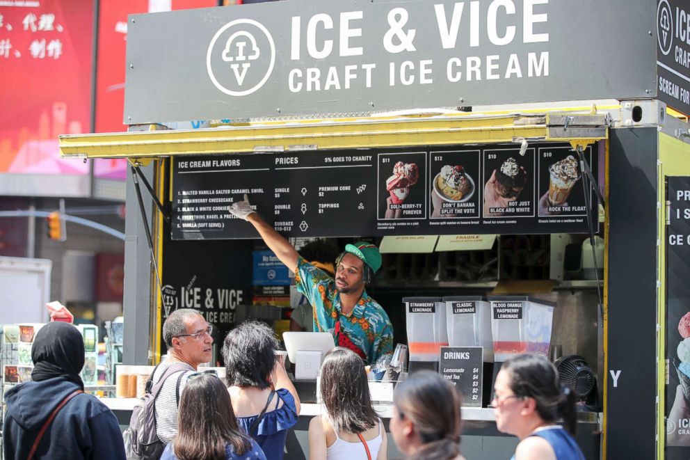 PHOTO: People queue to buy ice cream at Times Square in New York City, July 2, 2018.