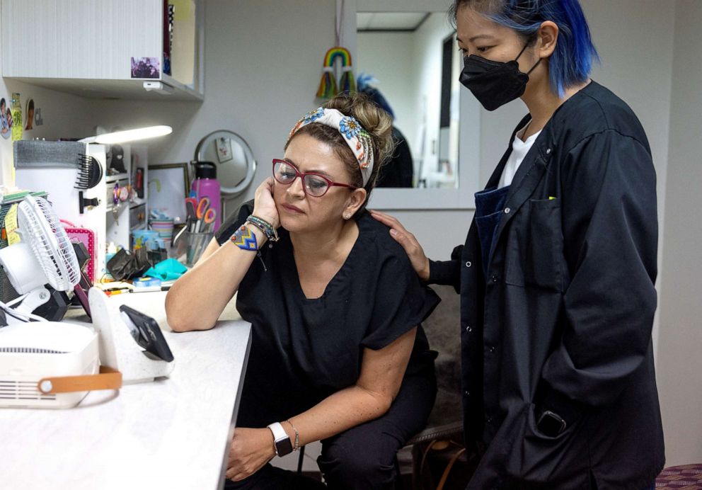 PHOTO: Staff at Houston Women's Reproductive Services watch a livestream of President Joe Biden delivering remarks before signing an executive order which seeks to safeguard abortion access, in Houston, Texas, on July 8, 2022.