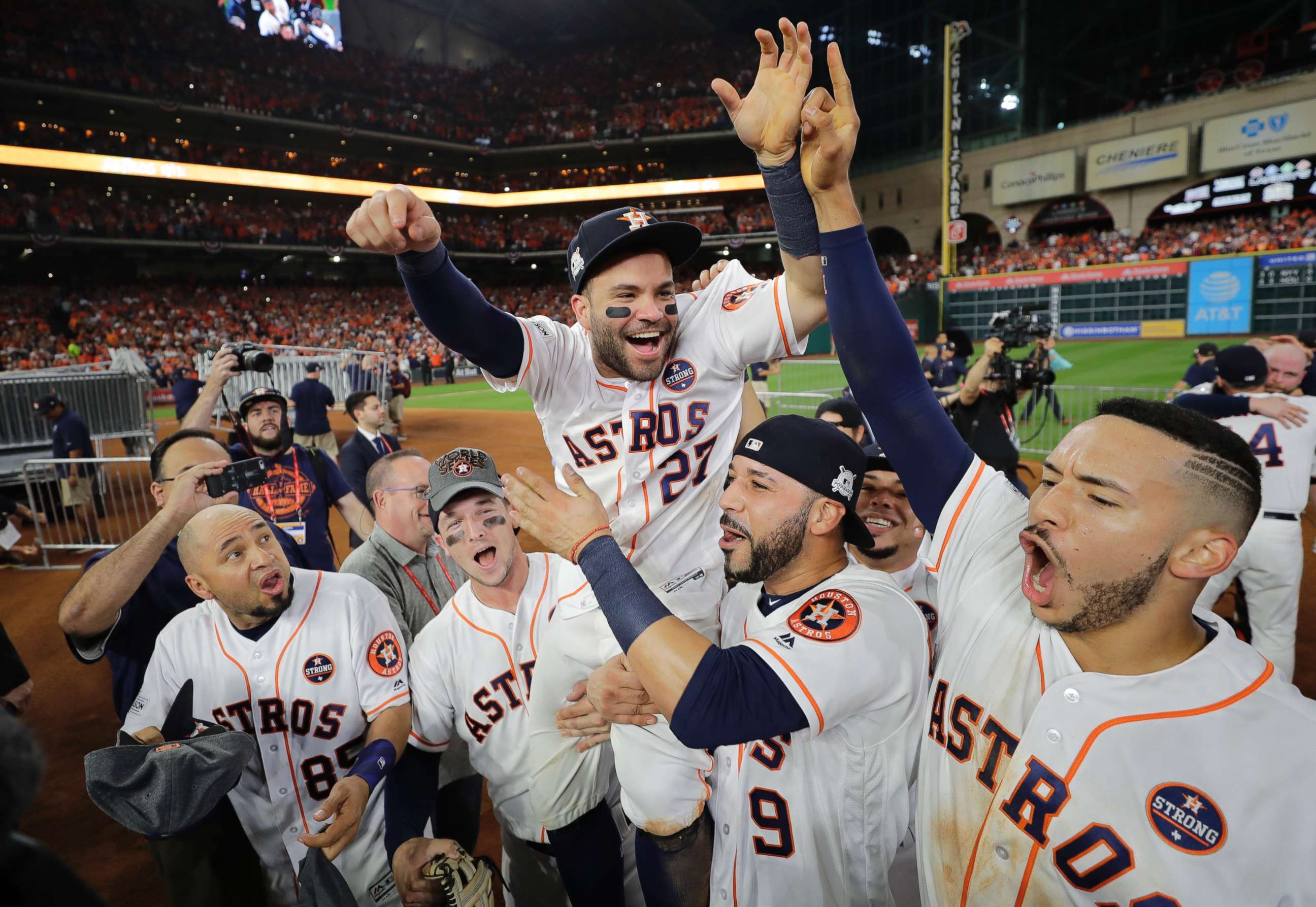 PHOTO: Houston Astros' Jose Altuve is lifted by teammates after Game 7 of baseball's American League Championship Series against the New York Yankees, Oct. 21, 2017, in Houston.