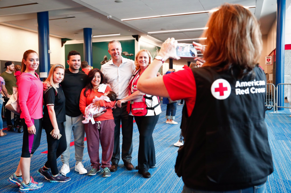 PHOTO: Astros members pose with a group of people in the George R. Brown Convention Center in a photo posted to the team's Twitter account on Sept. 1, 2017.