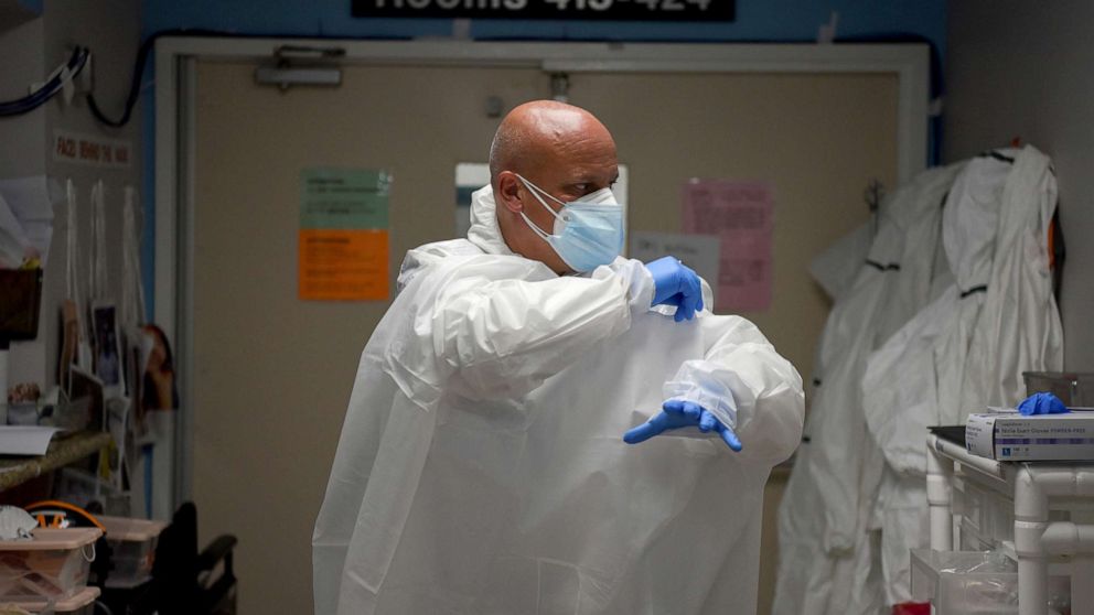 Dr. Joseph Varon, 58, the chief medical officer at United Memorial Medical Center (UMMC), puts on personal protective equipment (PPE), before treating COVID-19 patients at United Memorial Medical Center, during the coronavirus disease (COVID-19) outbreak, in Houston, Texas, July 17, 2020.