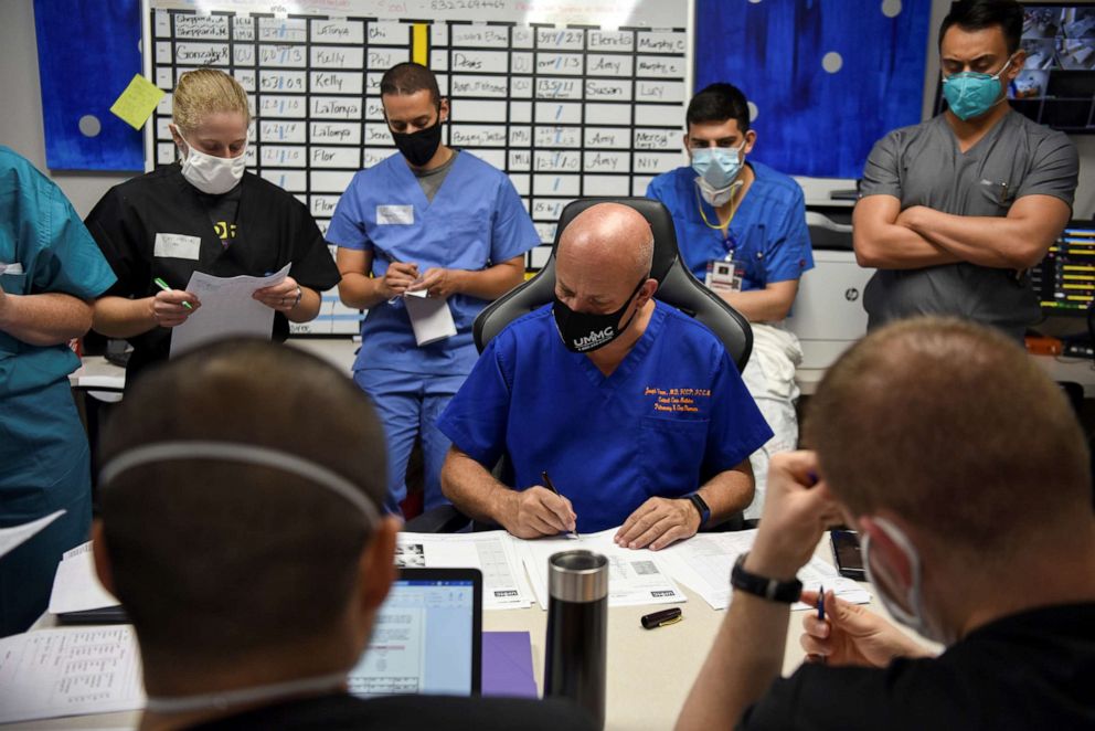 PHOTO: Dr. Joseph Varon, the chief medical officer at United Memorial Medical Center goes over the files of patients infected with COVID-19 at a daily meeting with his team of healthcare workers at UMMC, in Houston, Texas, July 17, 2020.