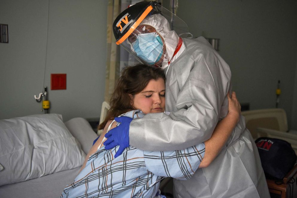 PHOTO: Dr. Joseph Varon hugs Christina Mathers, 43, a nurse from his team who became infected with COVID-19, at United Memorial Medical Center, during the coronavirus disease (COVID-19) outbreak, in Houston, Texas, July 25, 2020.