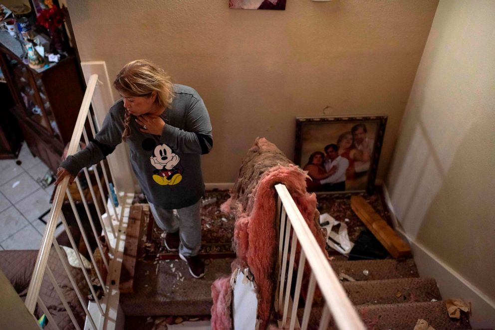 PHOTO: Maria Hernandez looks through her damaged home after an explosion at a northwest Houston, Texas manufacturing business, on Jan. 24, 2020.