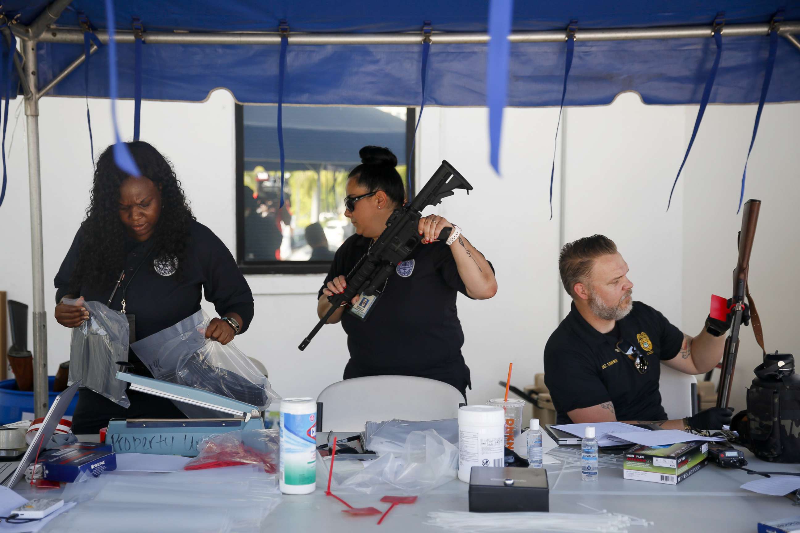 PHOTO: Police officers collect guns during a buyback program in Miami, June 18, 2022. 