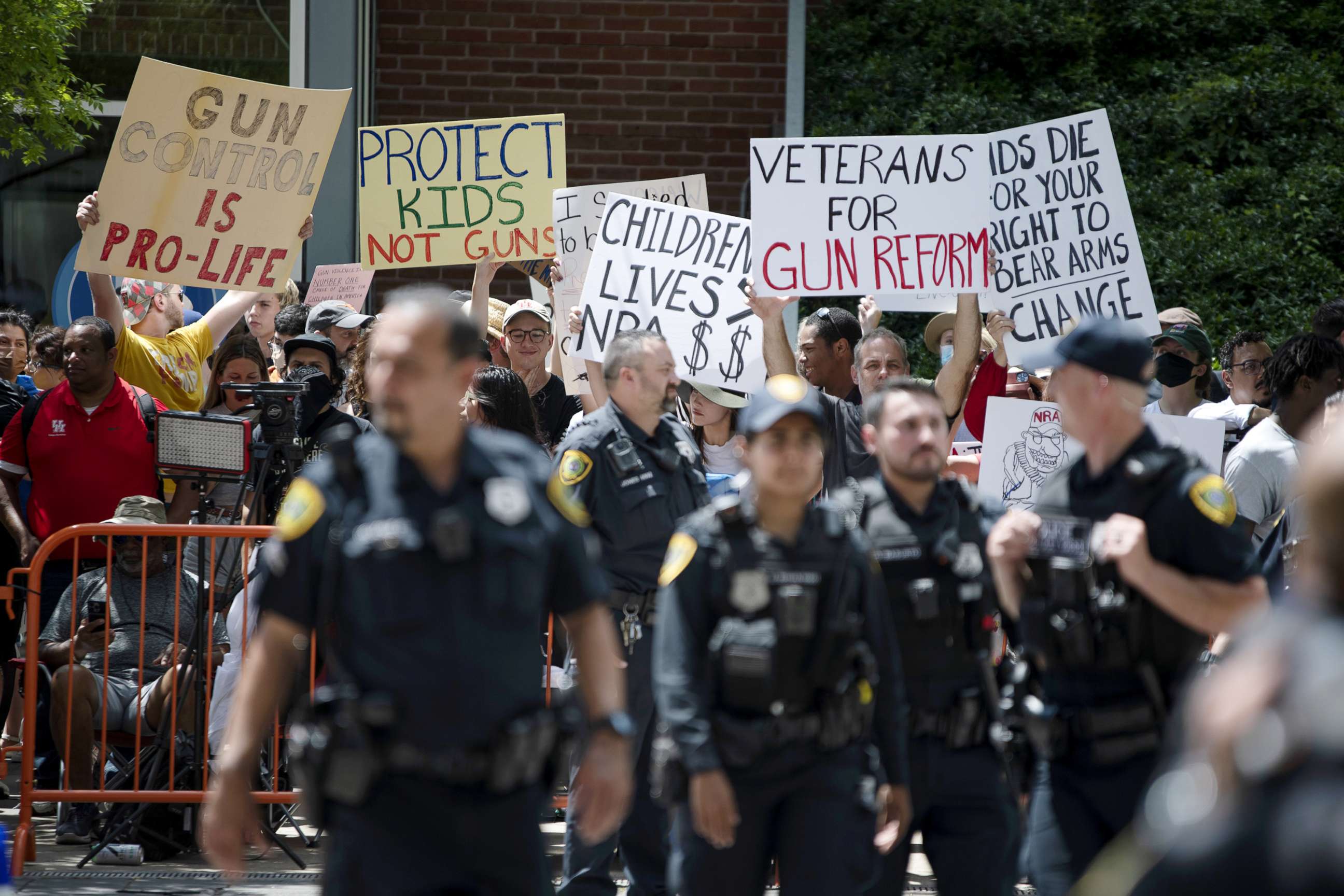 PHOTO: Demonstrators protest during the National Rifle Association annual convention in Houston, May 27, 2022. 