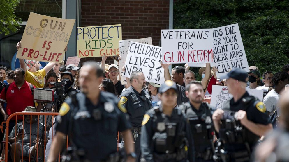 PHOTO: Demonstrators protest during the National Rifle Association annual convention in Houston, May 27, 2022. 