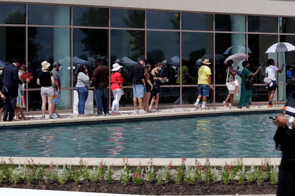PHOTO: Guest line up outside for the visitation for George Floyd at the Fountain of Praise Church, June 8, 2020 in Houston.