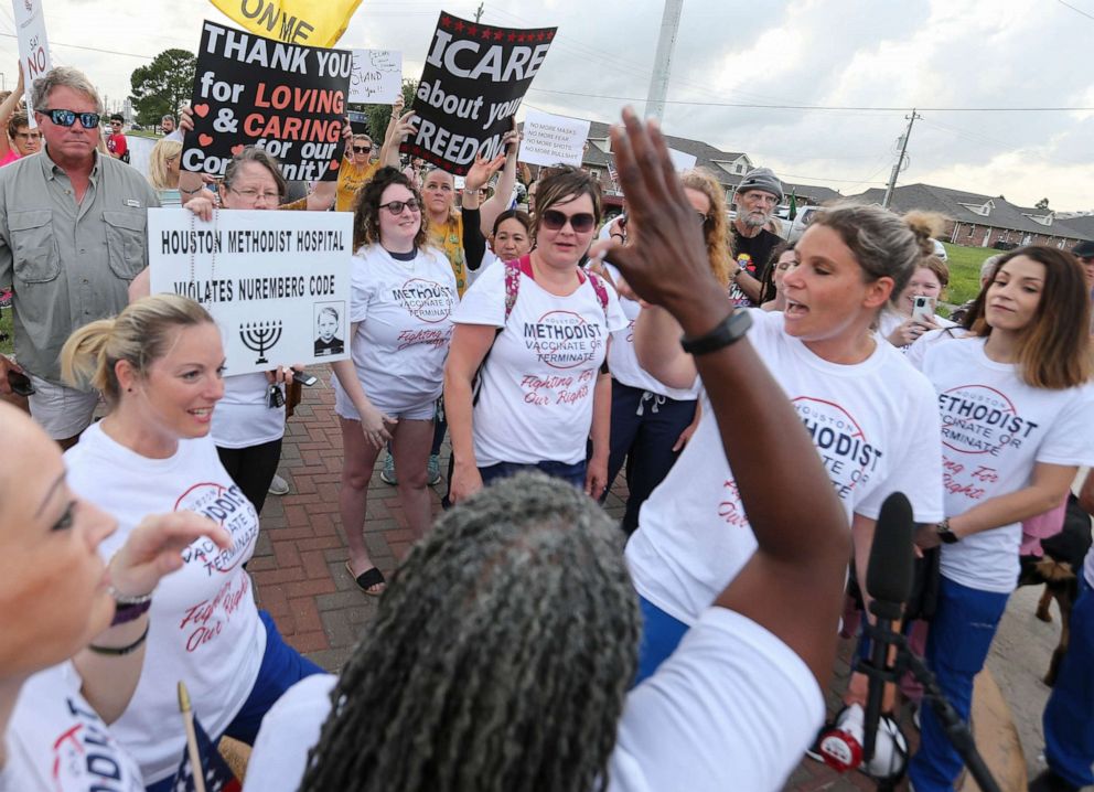 PHOTO: People gather to protest Houston Methodist Hospital system's rule of firing any employee who is not immunized by Monday, June 7, 2021, at Houston Methodist Baytown Hospital in Baytown, Texas.