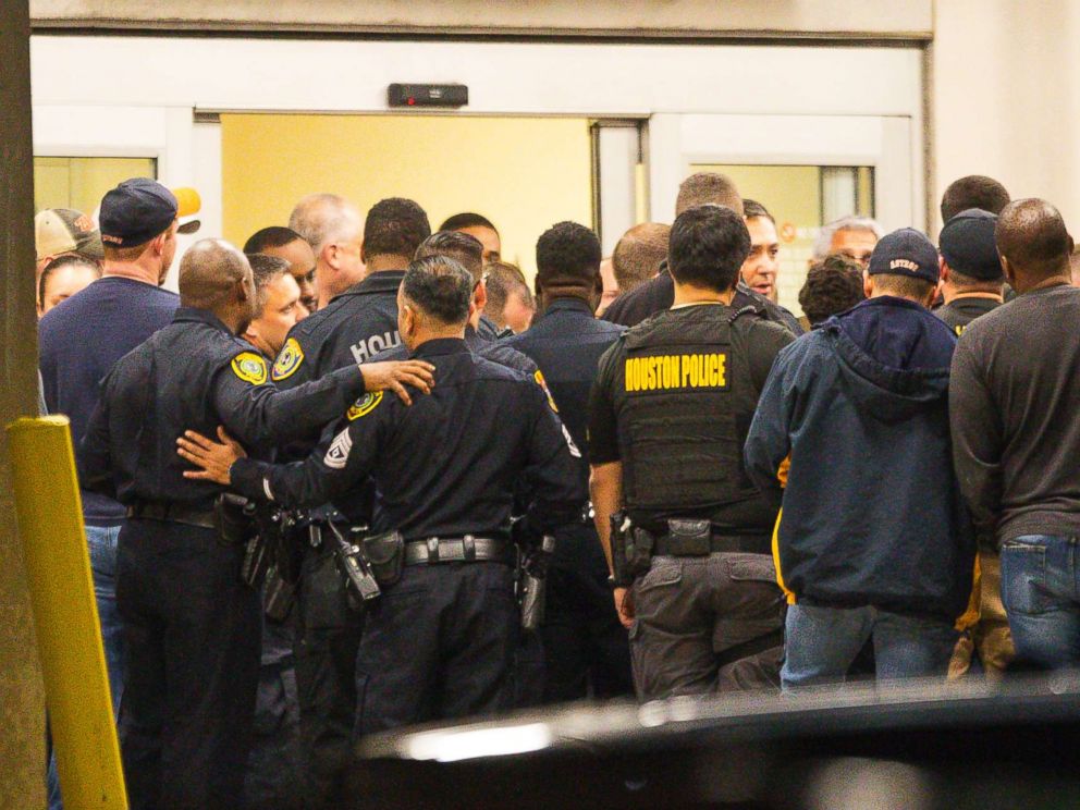 PHOTO: Officers listen as Houston Police Chief Art Acevedo comes outside of the emergency department at Memorial Hermann Hospital after visiting injured officers in the Texas Medical Center, Jan. 28, 2019, in Houston.