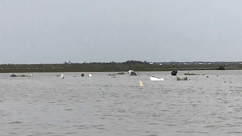 Debris from a Boeing 767 lies in Trinity Bay, near Anahuac, Texas, after it crashed Saturday, Feb. 23, 2019. Three people were on board and presumed dead.