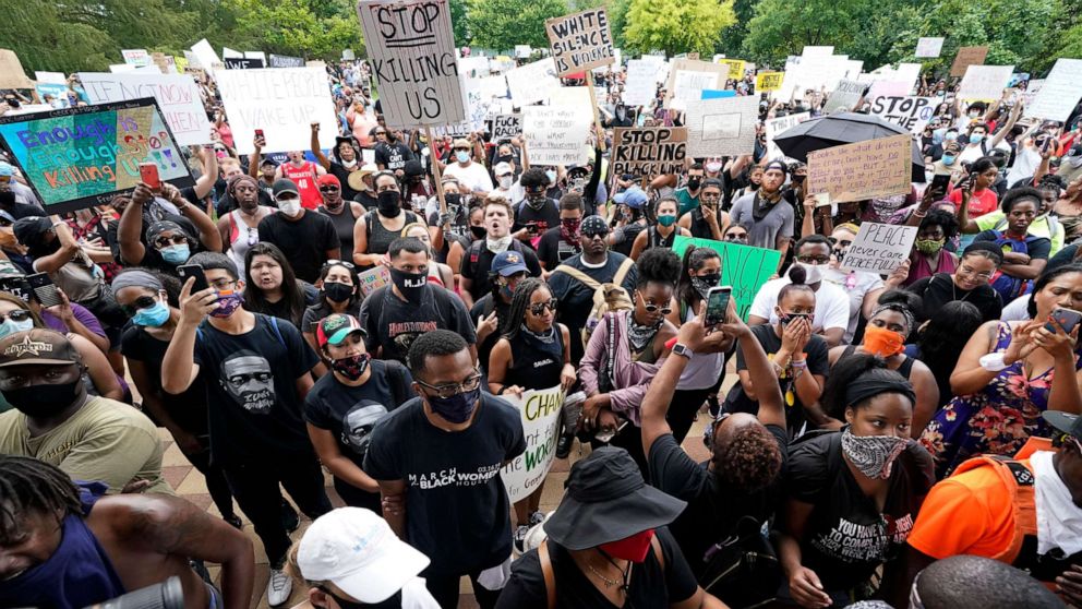 PHOTO: People gather to protest the death of George Floyd in Houston on Tuesday, June 2, 2020.