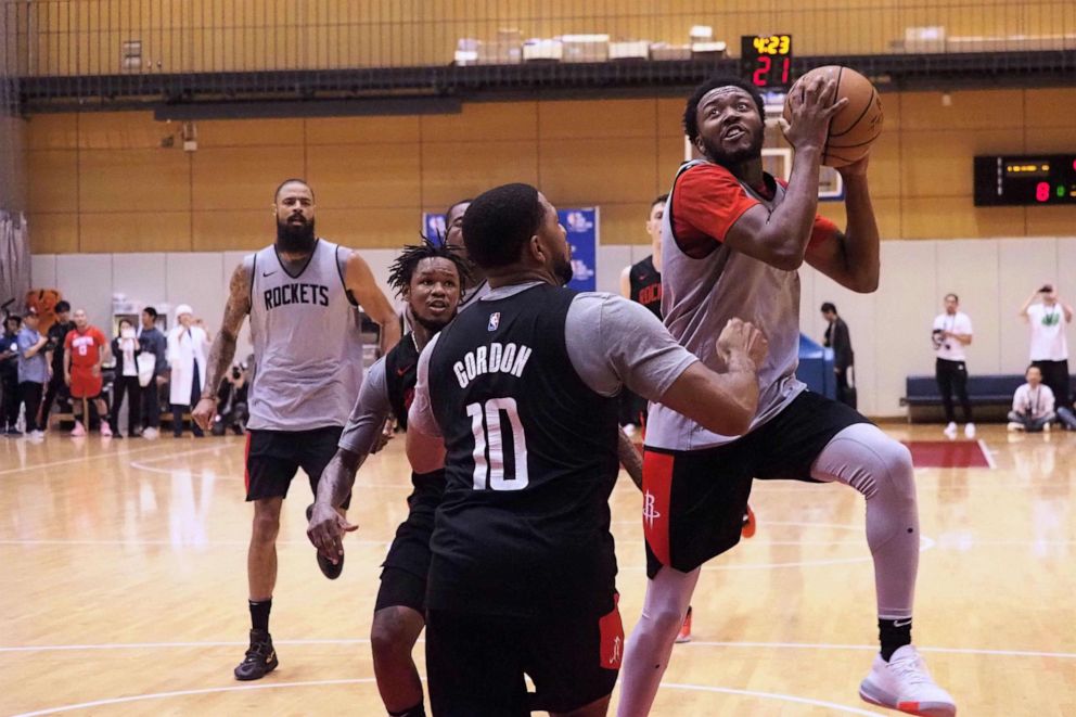 PHOTO: Houston Rockets guard Shamorie Ponds (R) tries to shoot over guard Eric Gordon (C) during a training session by the NBA basketball team in Tokyo on October 7, 2019. The Rockets are in Tokyo to play two exhibition matches this week.