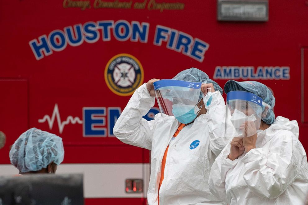 PHOTO: Medical practitioners wear personal protective equipment before entering 12200 Chessington Drive in southwest Houston, April 30, 2021.