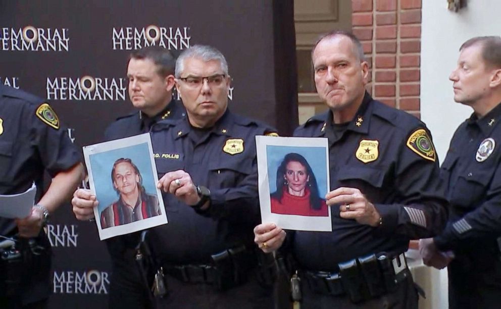 PHOTO: Houston police officers hold the photos of two suspects in the shooting of five police officers during a press conference at a hospital in Houston, Jan. 19, 2019. The suspects were identified as Dennis Tuttle, 59, and Rhogena Nicholas, 58.