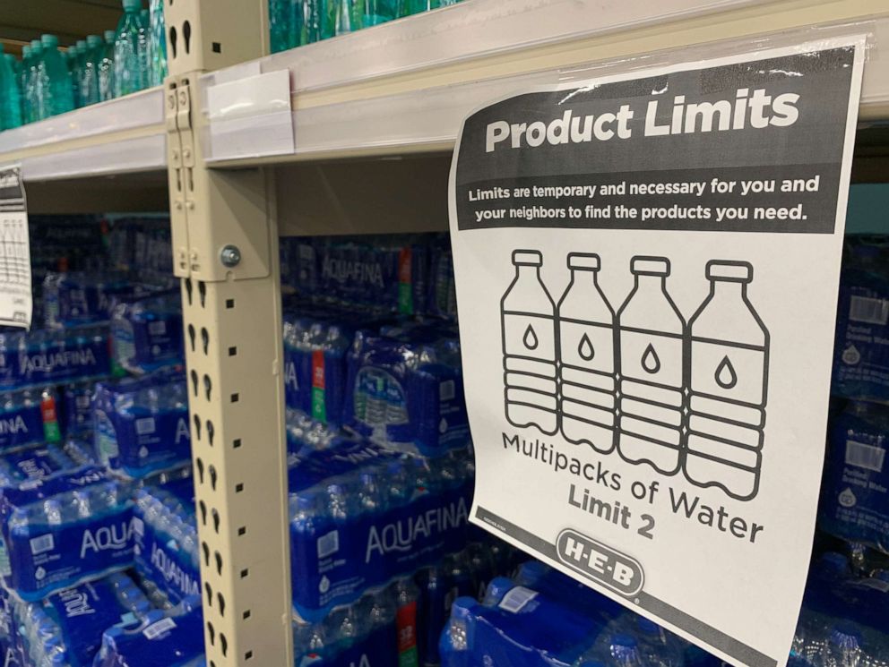PHOTO: A "Product Limits' sign is seen next to water shelves in a supermarket in Houston following winter storm Uri that left millions without power and caused water pipes to burst, on Feb. 20, 2021.