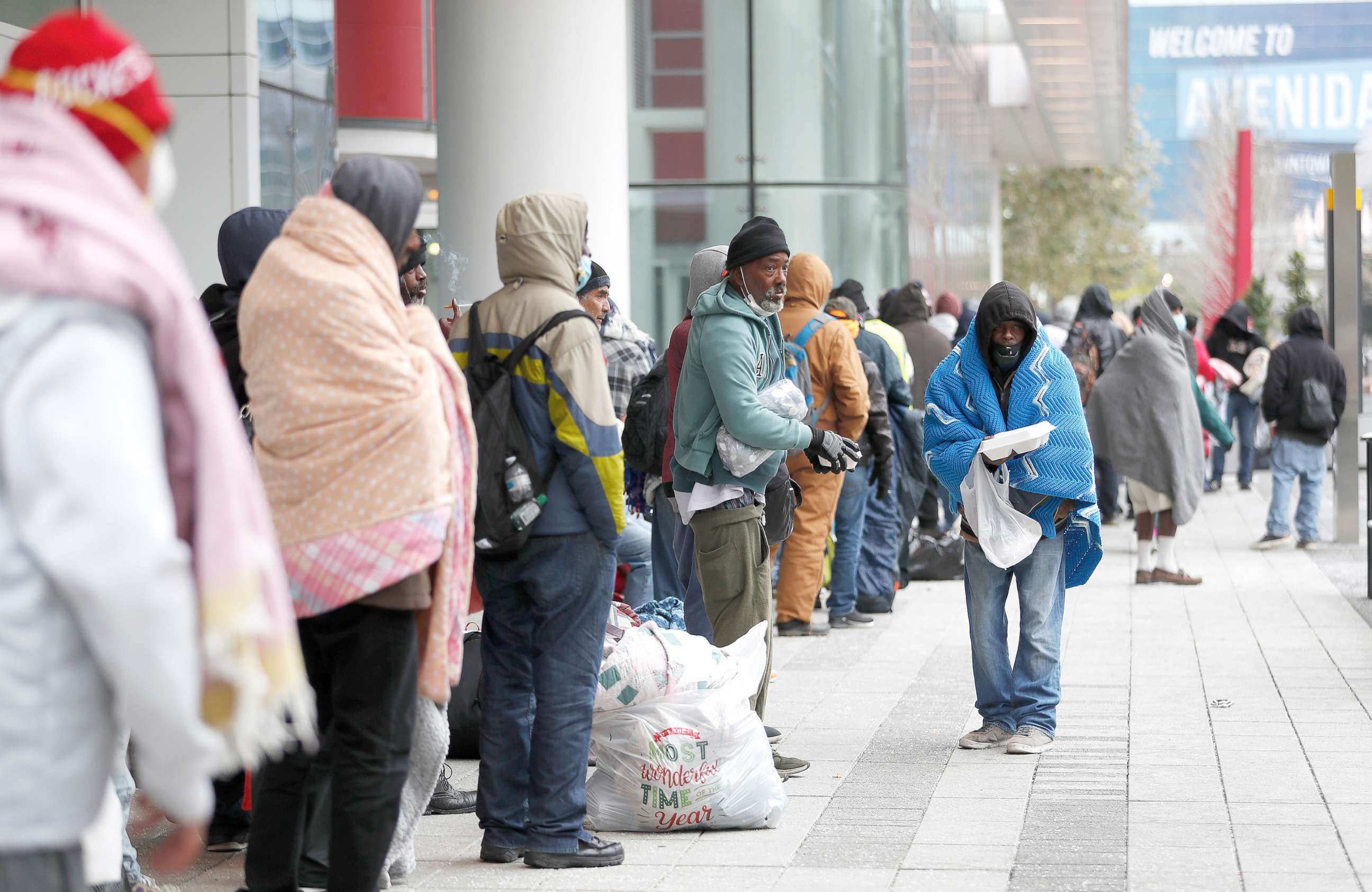 PHOTO: A line of more than 200 people formed outside at the George R. Brown Convention Center, in Houston, Feb. 14, 2021, which city officials opened as an emergency shelter for the area homeless, who needed to get out of the freezing temperatures.