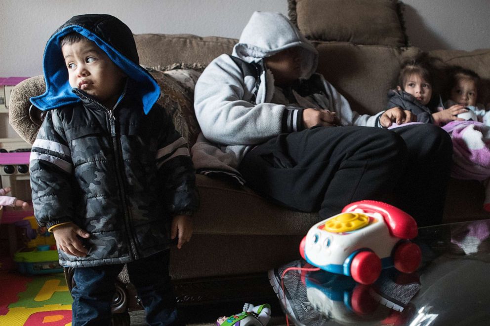 PHOTO: Eithan Colindres wears a winter coat inside after the apartment his family lives in the Greenspoint area that lost power following an overnight snowfall Monday, Feb. 15, 2021 in Houston.