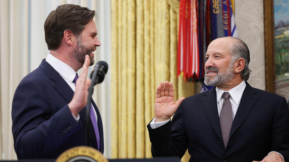 PHOTO: Howard Lutnick is sworn in as U.S. Commerce Secretary by Vice President JD in the Oval Office at the White House, Feb. 21, 2025 in Washington.