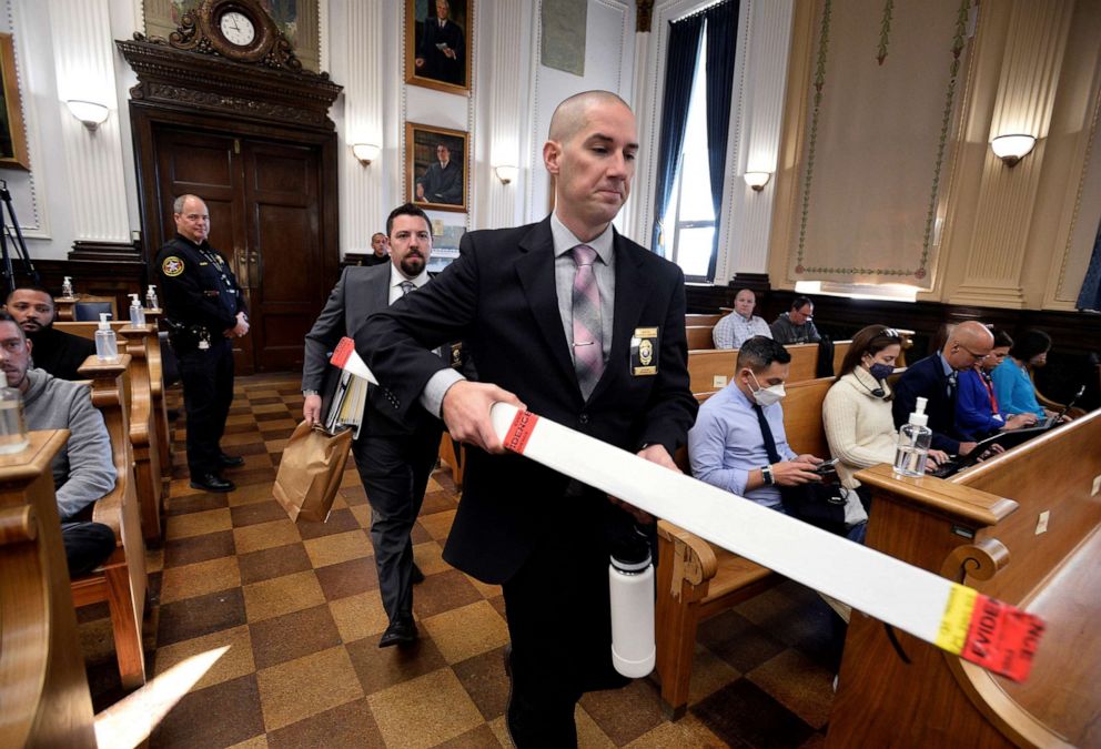 PHOTO: Kenosha Police Department Detective Martin Howard carries the weapon Kyle Rittenhouse used the night of Aug. 25 into the courtroom for Rittenhouse's trial at the Kenosha County Courthouse in Kenosha, Wis., Nov. 8, 2021.