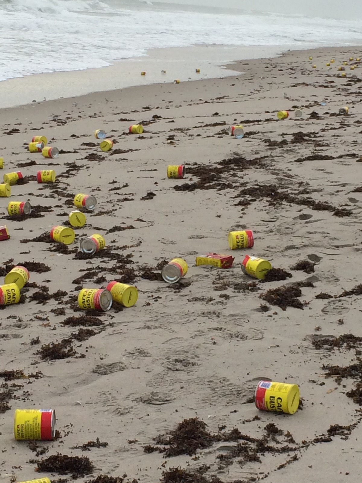 PHOTO: Hundreds of coffee cans mysteriously washed ashore a beach in Indialantic, Florida, on Dec. 8, 2015. 