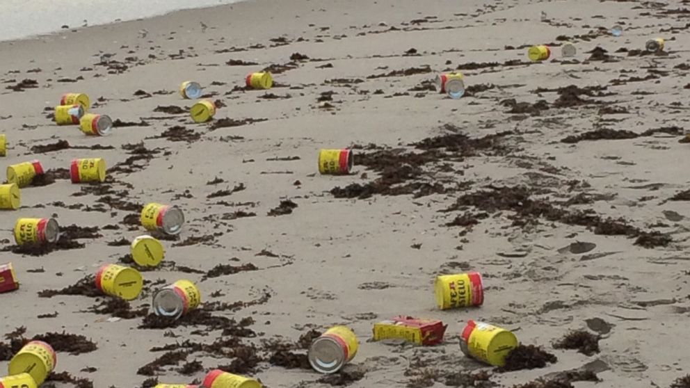 PHOTO: Hundreds of coffee cans mysteriously washed ashore a beach in Indialantic, Florida, on Dec. 8, 2015. 