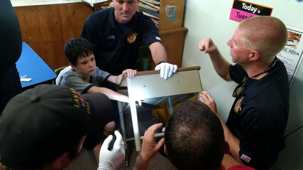 PHOTO: Lakeland Fire Department rescue crews worked patiently and kept Gio Aponte calm as they worked to free his finger from the desk, June 30, 2016.